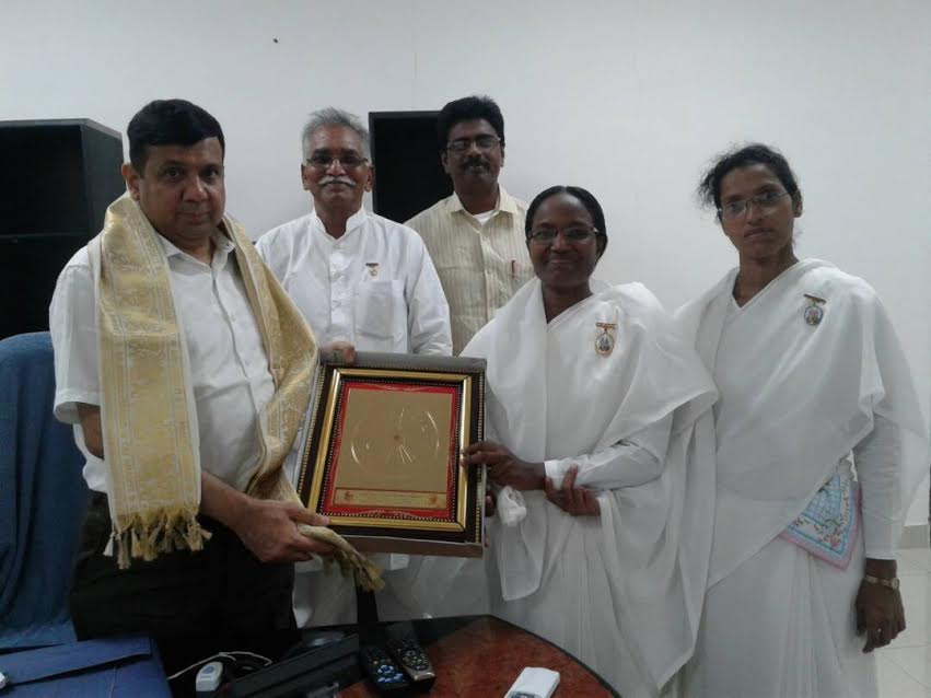 Radha behn giving Godly gift to Bro.Ajay jain CRDA Principal Secretary to Govt of AndhraPradesh